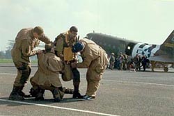 Lieutenant Lewis Nixon (actor Ron Livingston) getting kitted up.