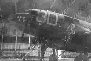 Crew Chief Sidney Risher's C-47 42-100561 under repair in a hangar at Membury